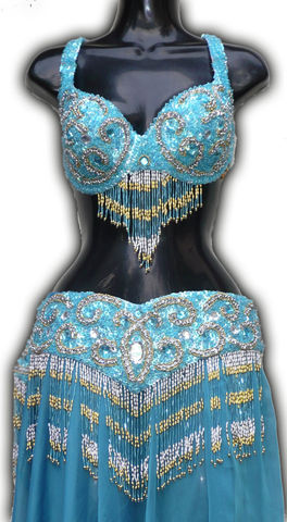 traje turquesa con bastones plata y oro $1600