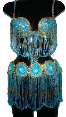 Traje circulos turquesa, oro $1600