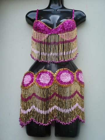 Traje circulos fiusha, rosa, oro $1600