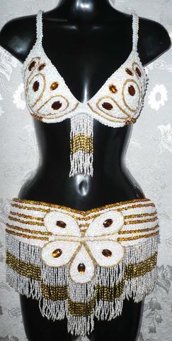 Traje flor blanco-oro $1600